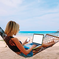 lady in a hammock with a laptop
